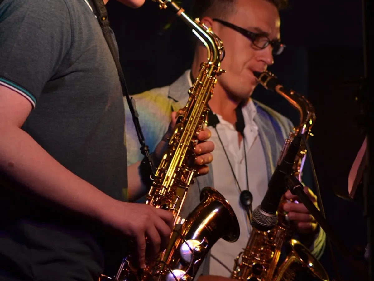 A teacher and student playing saxophone together at Rīgas Privātā Mūzikas Skola in Riga